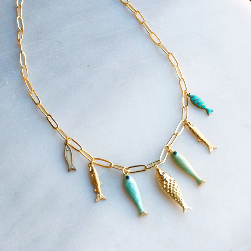 Desert Tide Necklace – Gold Chain with Playful Fish Charms