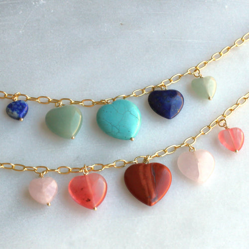 Necklace with heart-shaped gemstones on a light background
