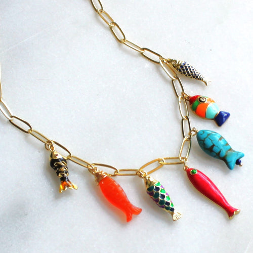Necklace with colorful fish-shaped pendants on a white background