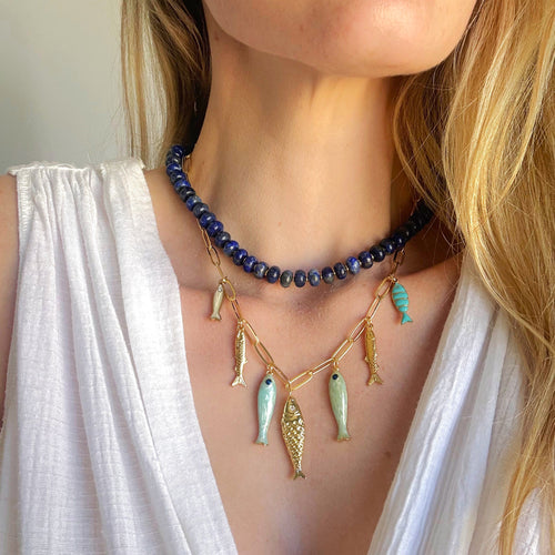 Desert Tide Necklace – Gold Chain with Playful Fish Charms