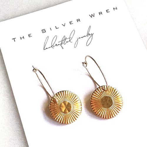 Gold earrings on a card with 'The Silver Wren' branding