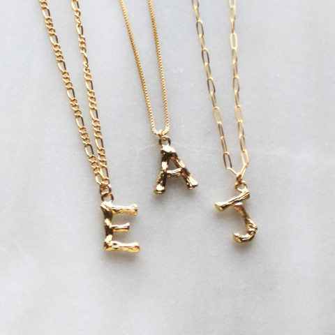 Gold bamboo store letter necklace